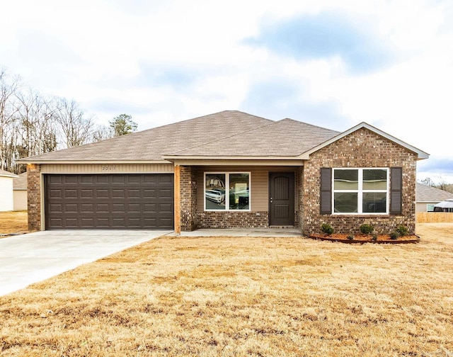 ranch-style house with a garage and a front lawn