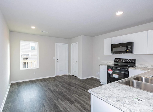 kitchen featuring black appliances, dark hardwood / wood-style flooring, white cabinets, and sink