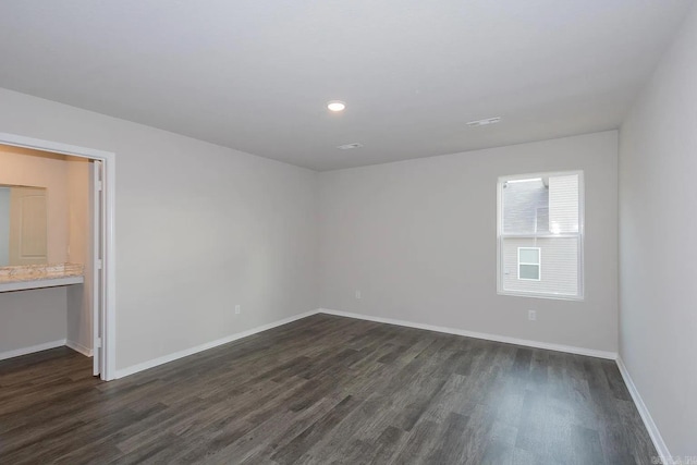 empty room featuring dark hardwood / wood-style floors