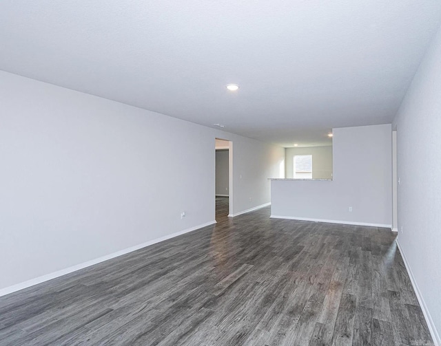 empty room featuring dark wood-type flooring