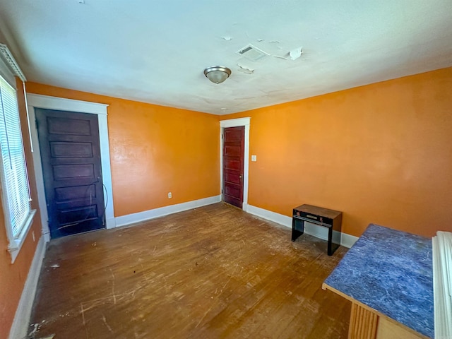 2600 S Battery, Little Rock, AR 72206 - unfurnished bedroom with wood finished floors, baseboards, and multiple windows