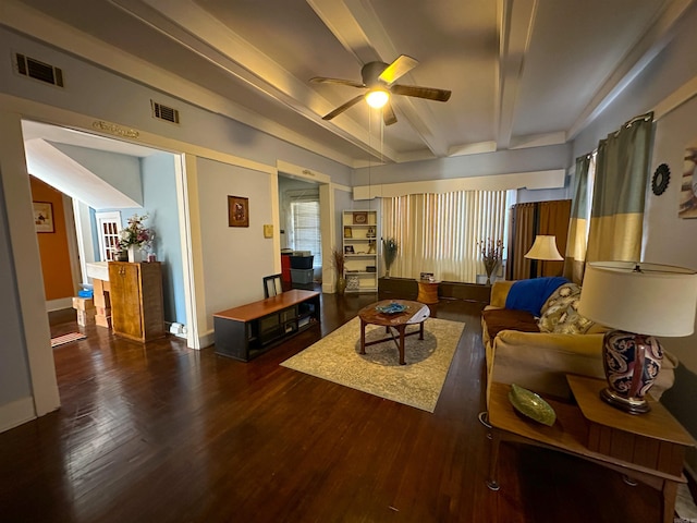 living room featuring dark hardwood / wood-style floors, beam ceiling, and ceiling fan