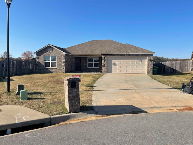 single story home featuring a front yard and a garage