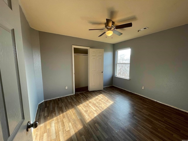 unfurnished bedroom with ceiling fan and hardwood / wood-style floors