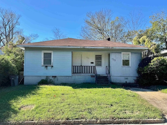 view of front of home featuring covered porch and a front yard