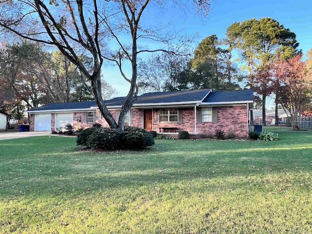 ranch-style house with a garage and a front lawn