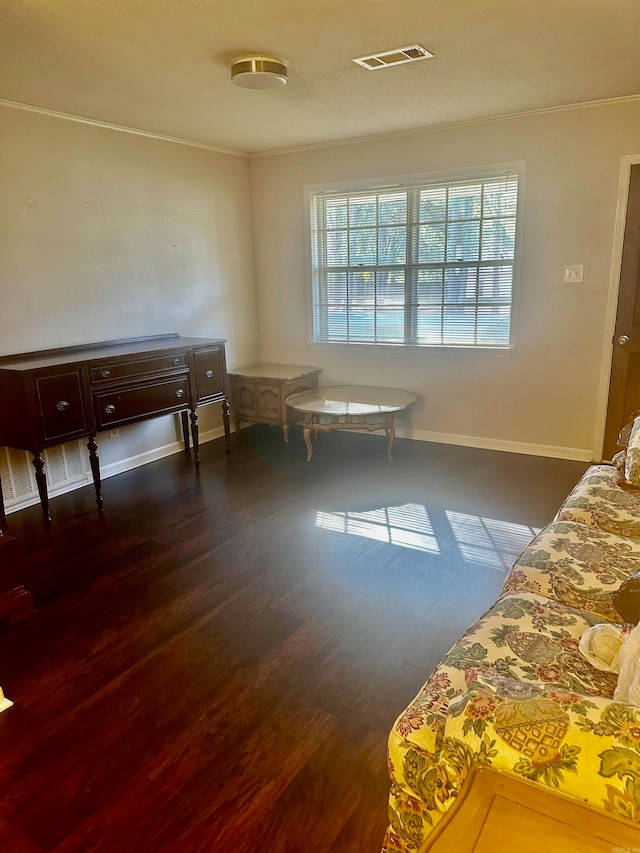 interior space featuring crown molding and dark wood-type flooring