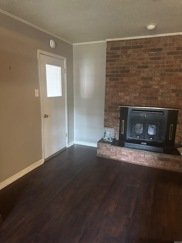 unfurnished living room with dark hardwood / wood-style flooring and crown molding