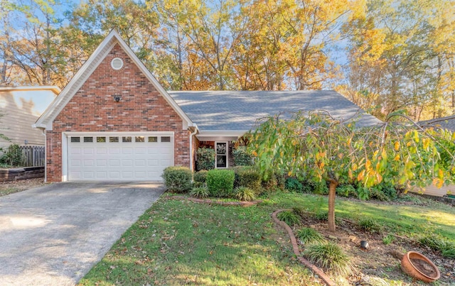 view of front of property featuring a front yard and a garage