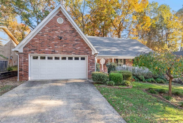 view of front of property with a garage and covered porch