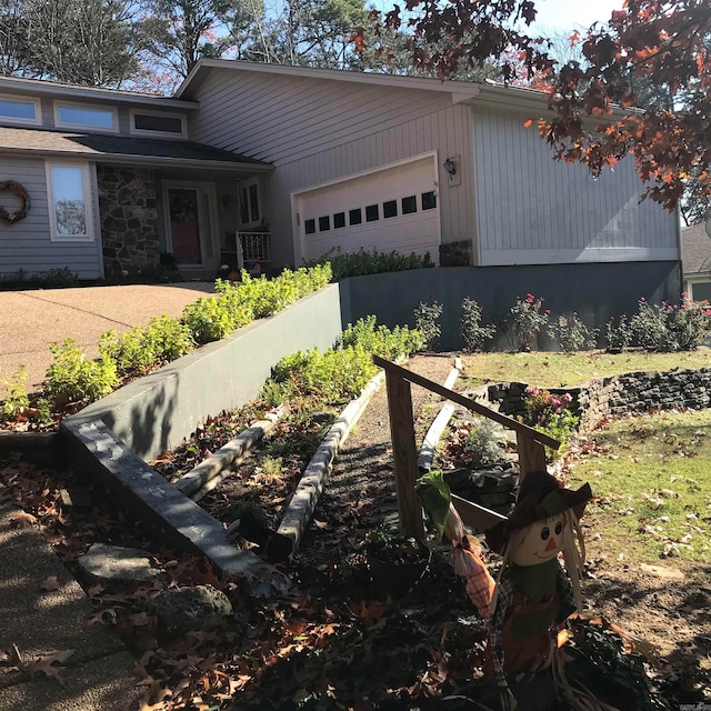 view of side of property featuring a garage