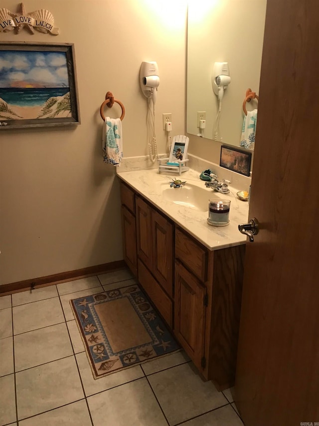 bathroom with tile patterned flooring and vanity