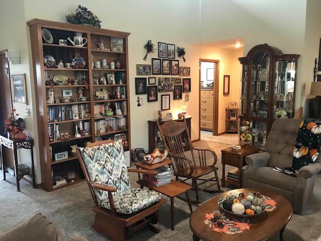 sitting room featuring light colored carpet