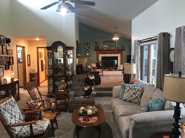 living room with carpet flooring, a fireplace, and high vaulted ceiling