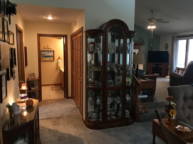 tiled living room featuring ceiling fan