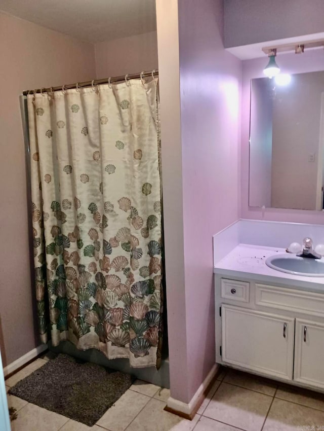 bathroom with tile patterned floors, vanity, and a shower with shower curtain