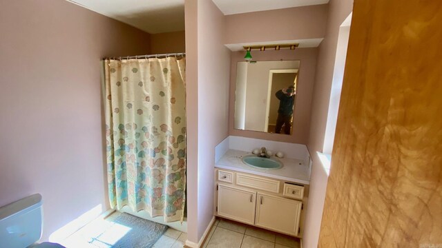 bathroom with tile patterned flooring and vanity