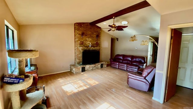 living room featuring plenty of natural light, lofted ceiling with beams, and wood-type flooring