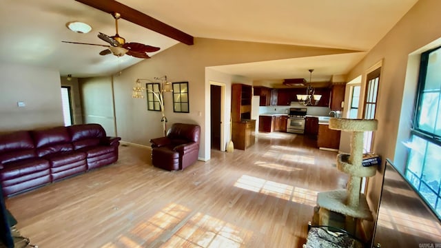 living room with lofted ceiling with beams, ceiling fan, light wood-type flooring, and sink