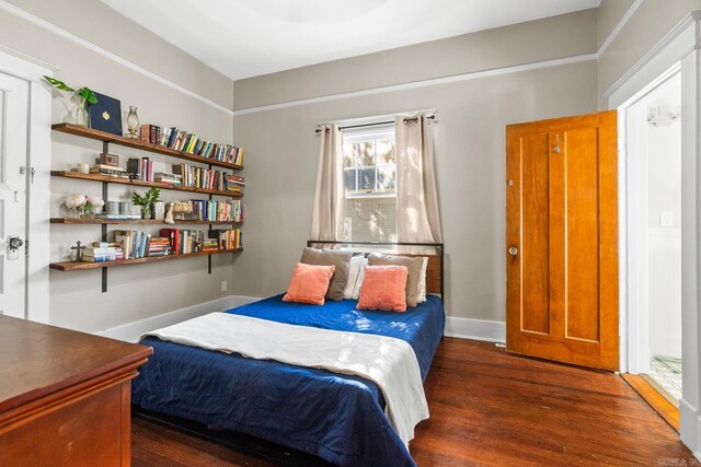 bedroom featuring dark hardwood / wood-style floors