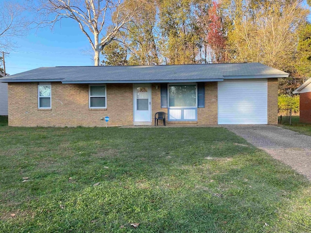 ranch-style home with a front lawn and a garage