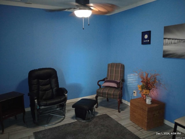 sitting room featuring ceiling fan