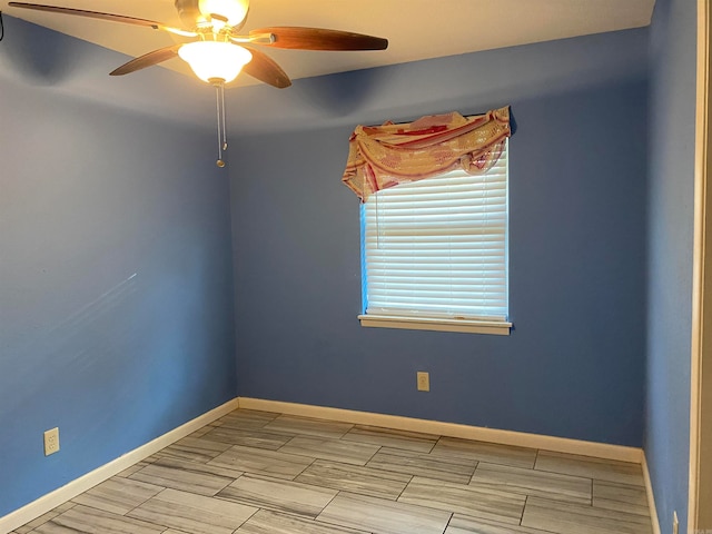 spare room with ceiling fan