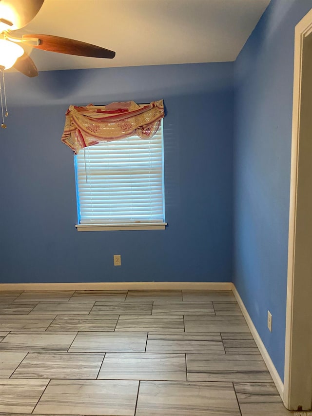 unfurnished room featuring hardwood / wood-style floors and ceiling fan