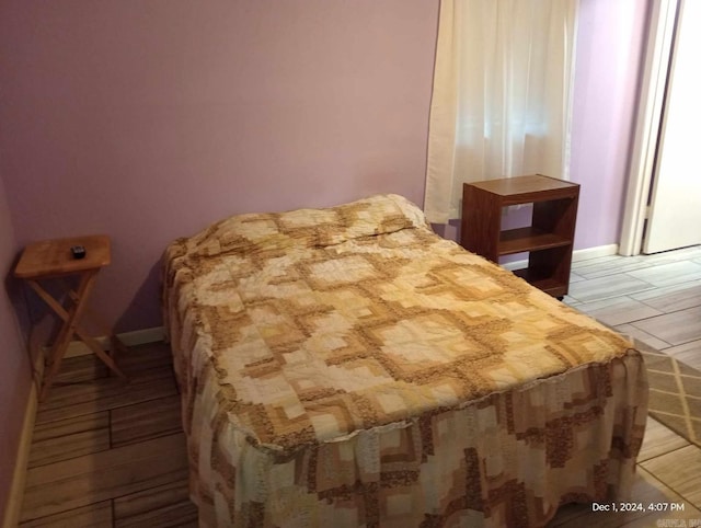 bedroom featuring hardwood / wood-style floors