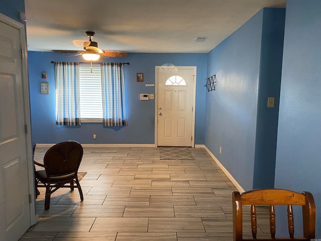 foyer featuring ceiling fan