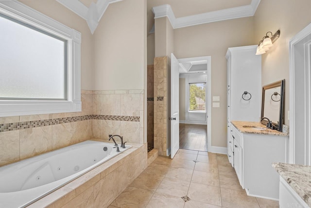 bathroom with crown molding, vanity, and independent shower and bath