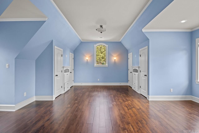 bonus room with dark hardwood / wood-style floors and vaulted ceiling