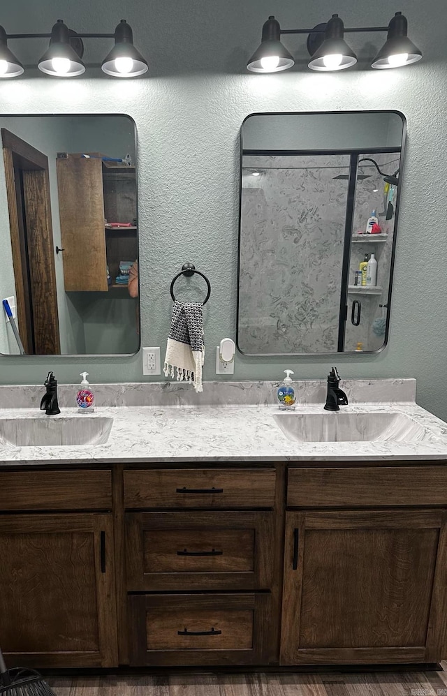 bathroom with hardwood / wood-style floors and vanity