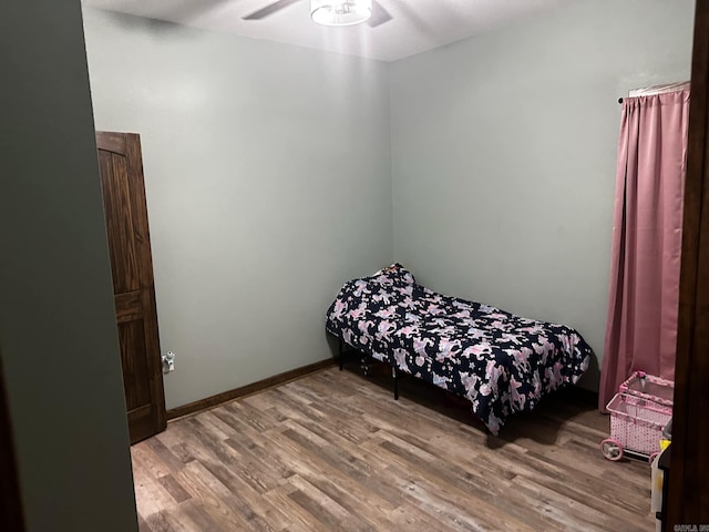 bedroom featuring hardwood / wood-style flooring and ceiling fan