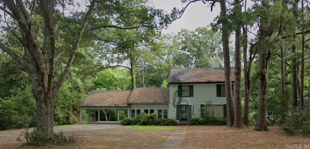 view of front of home featuring a carport