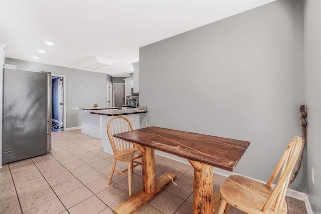 dining area with light tile patterned flooring