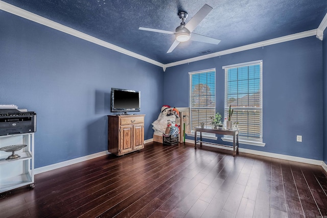 interior space with dark hardwood / wood-style floors, ceiling fan, crown molding, and a textured ceiling