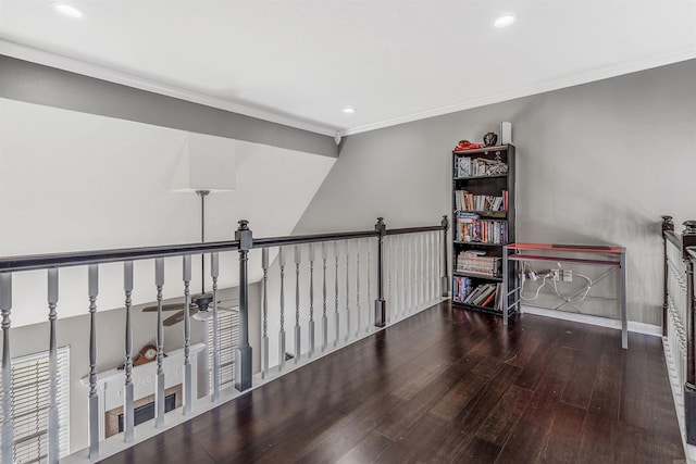 interior space featuring dark hardwood / wood-style flooring, ceiling fan, and crown molding