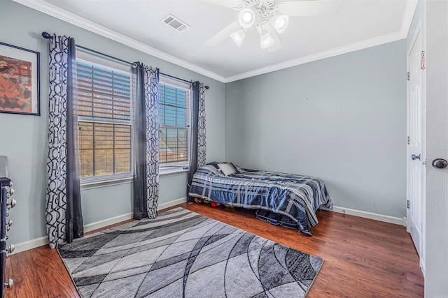 bedroom with multiple windows, dark hardwood / wood-style flooring, and ceiling fan