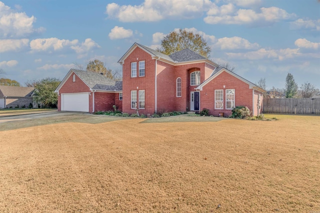 front facade with a front yard and a garage