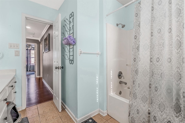 bathroom featuring hardwood / wood-style floors, vanity, ornamental molding, and shower / bathtub combination with curtain