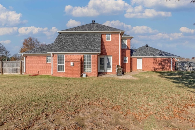 back of house with a yard