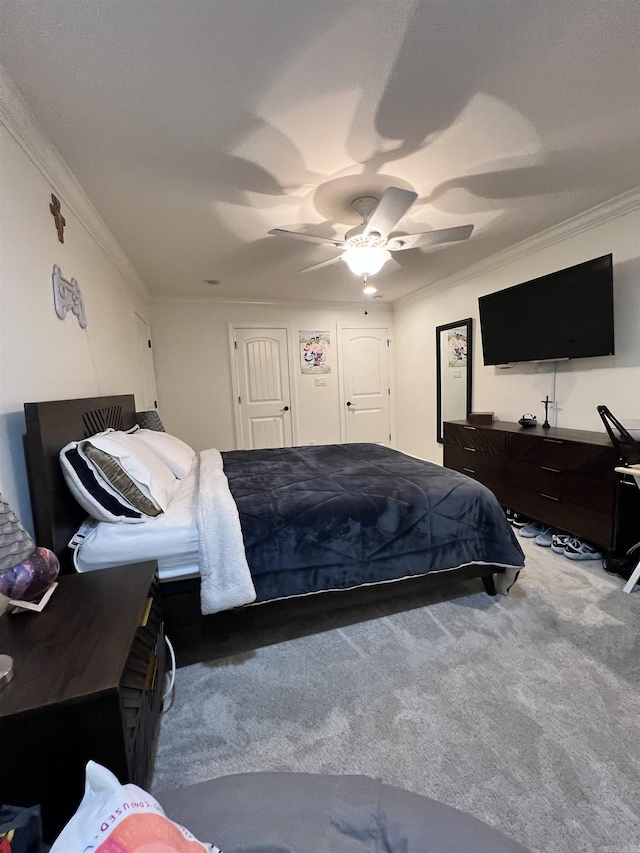 bedroom featuring carpet flooring, ceiling fan, and ornamental molding