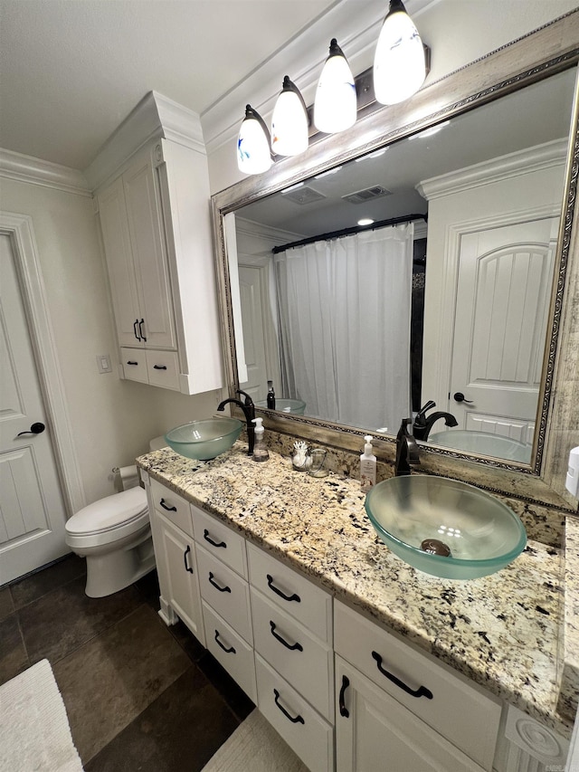 bathroom featuring a shower with shower curtain, vanity, toilet, and ornamental molding