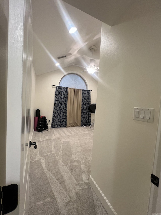 hallway with carpet floors