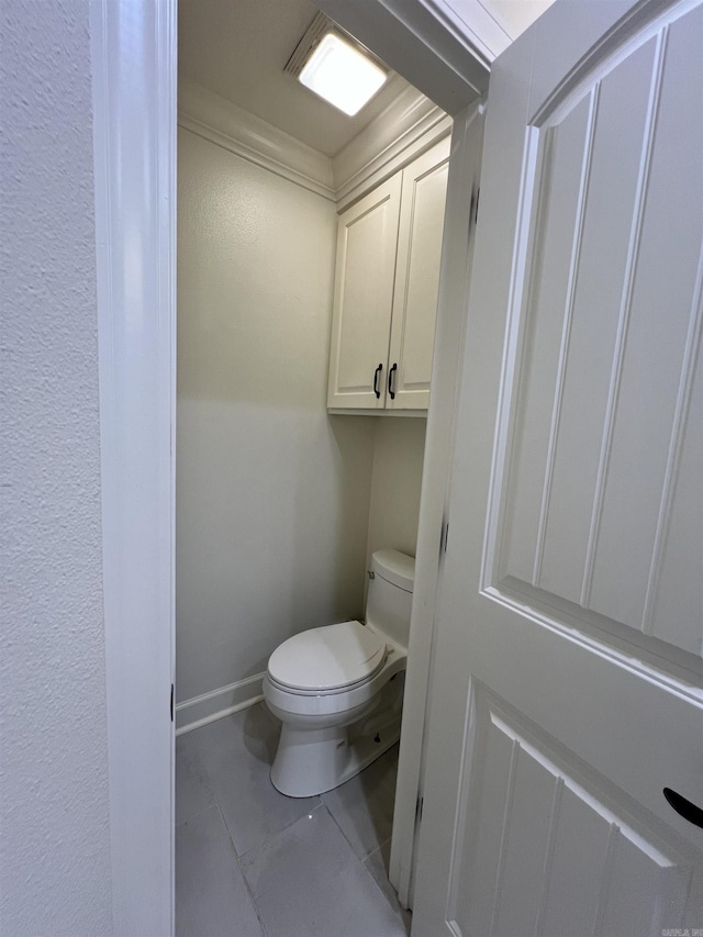 bathroom featuring tile patterned floors and toilet