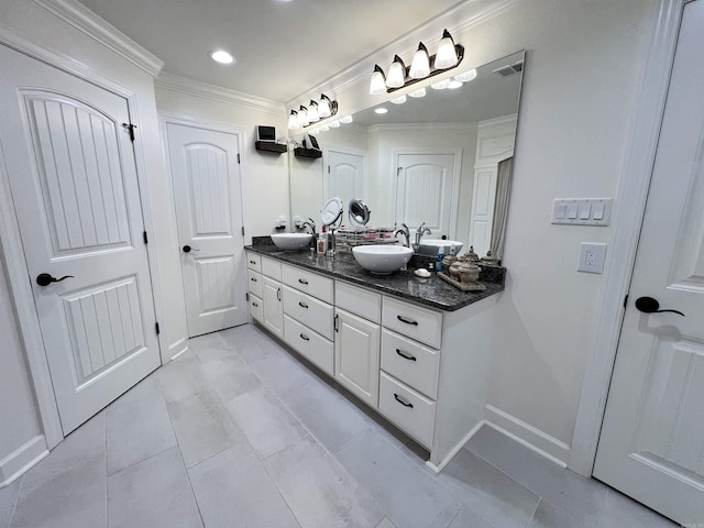 bathroom with tile patterned floors, vanity, and crown molding