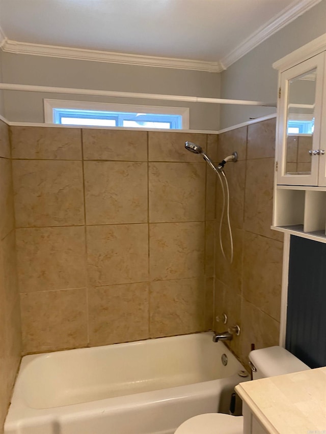 full bathroom with a wealth of natural light, toilet, tiled shower / bath combo, and ornamental molding