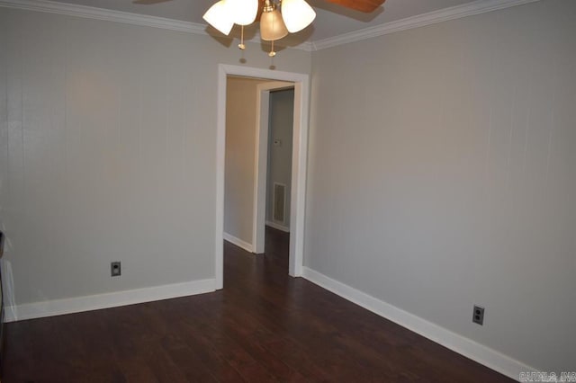 empty room featuring ceiling fan, dark hardwood / wood-style flooring, and crown molding