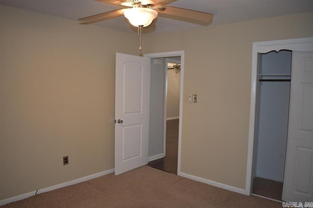 unfurnished bedroom featuring carpet flooring, ceiling fan, and a closet